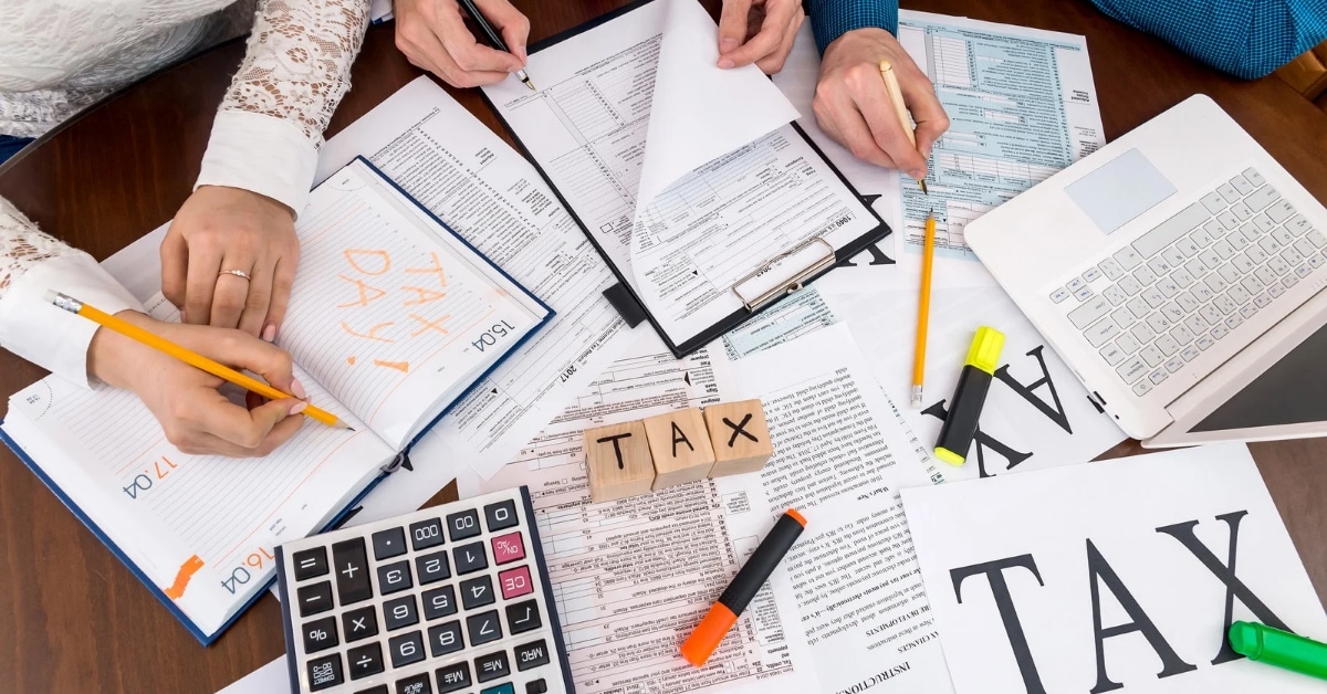 Small business tax documents and financial reports on a desk