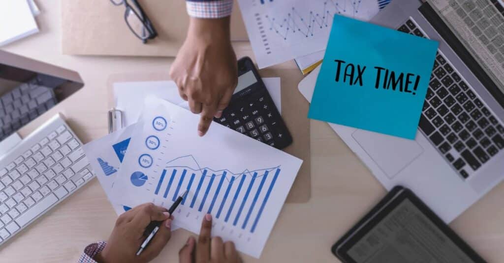 Tax professional assisting small business owner with tax preparation
