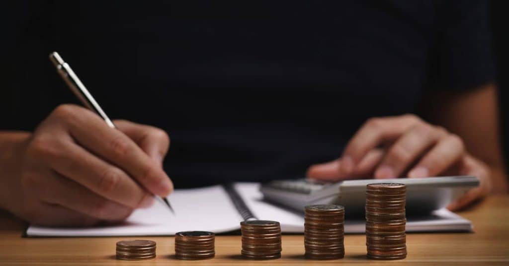 Business owner planning a sustainable budget with financial documents